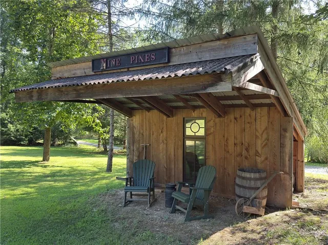 a view of an chairs and table in the patio