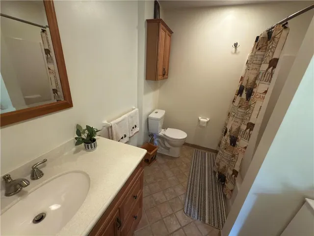 a view of living room with furniture and wooden floor