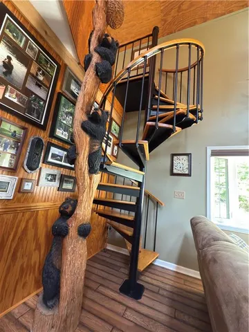 a kitchen with stainless steel appliances granite countertop a sink and a refrigerator