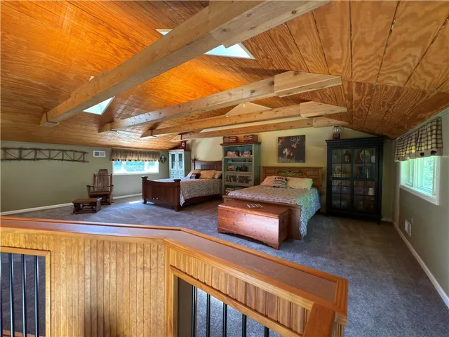 a bedroom with furniture and a window