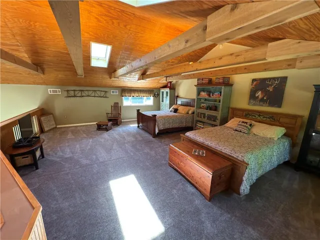 a bedroom with furniture and a window