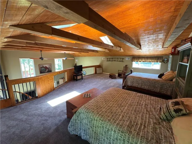 a bedroom with furniture and a window