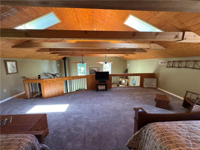 a bedroom with bed and window