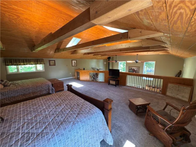 a living room with furniture and a mirror