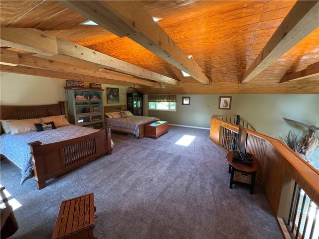 a view of a living room with furniture and a wooden floor