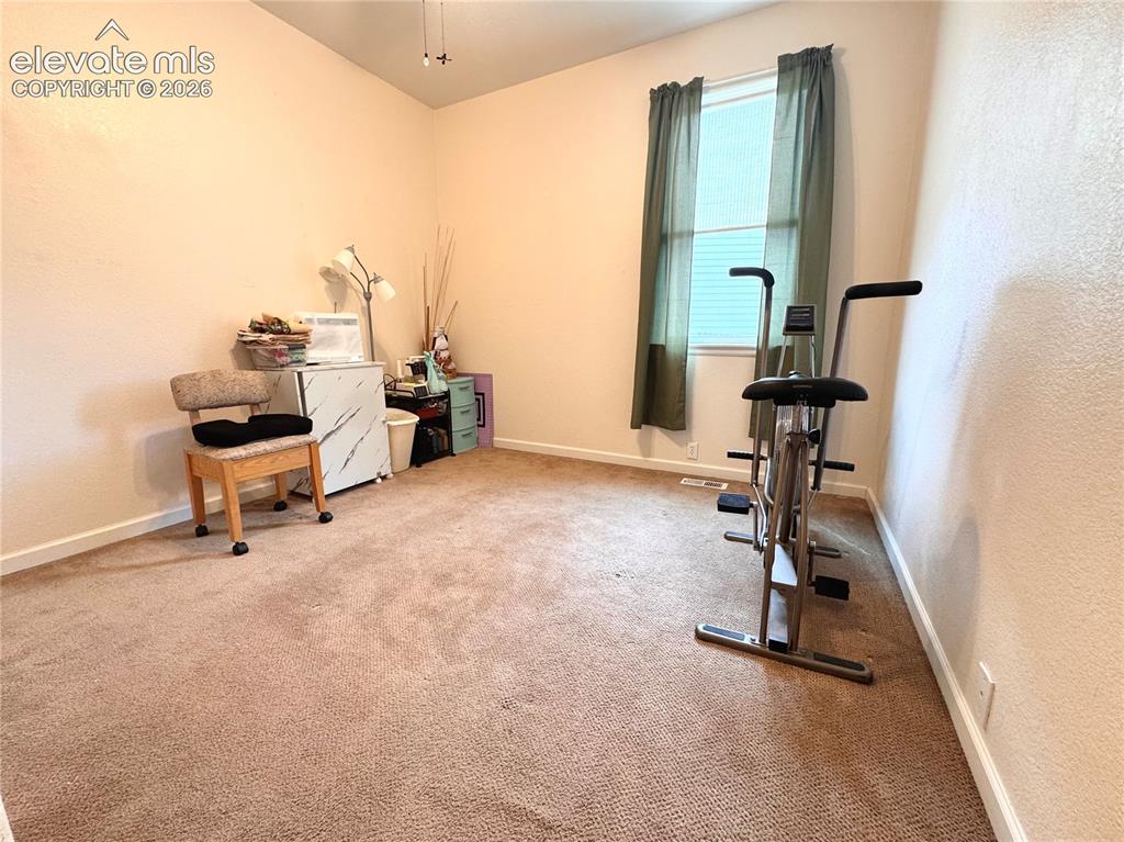 9362 St.George Road Peyton, CO 80831 - Photo 14 of 32 a view of a room with gym equipment