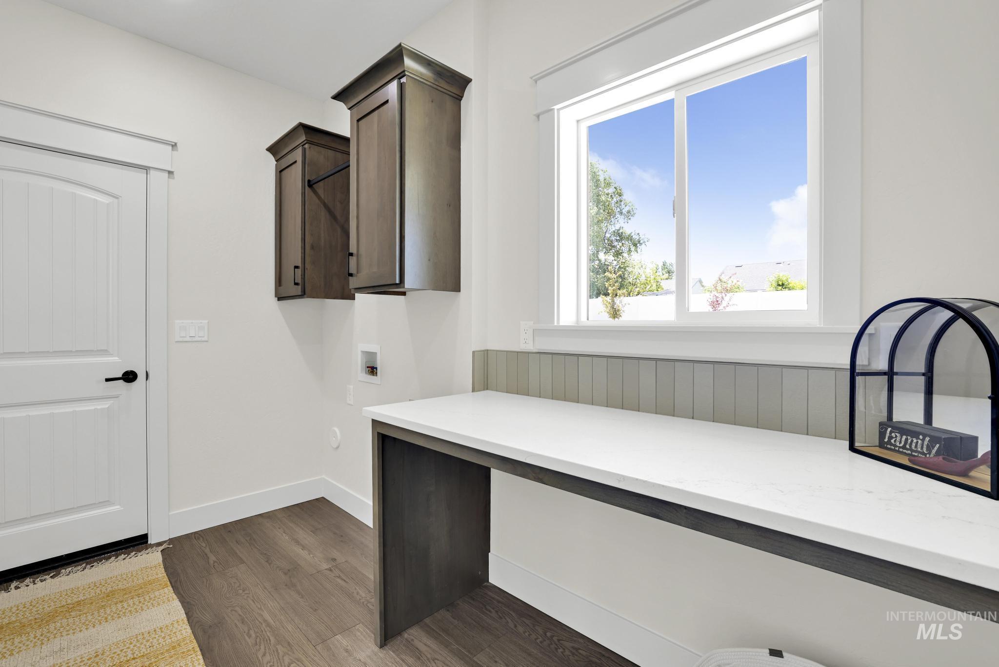 284 Sandi Road Twin Falls, ID 83301 - Photo 22 of 33 Room featuring a ceiling fan with integrated lighting, a double-hung window with white trim, light-colored walls, and gray carpet flooring