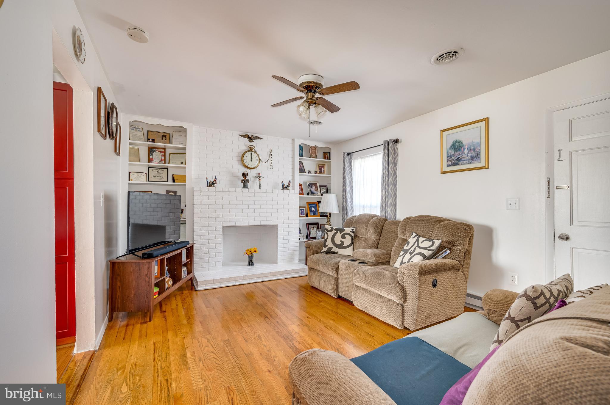 12 Orchard Drive Ranson, WV 25438 - Photo 6 of 38 wood burning fireplace. Ceiling fan keeps it airy