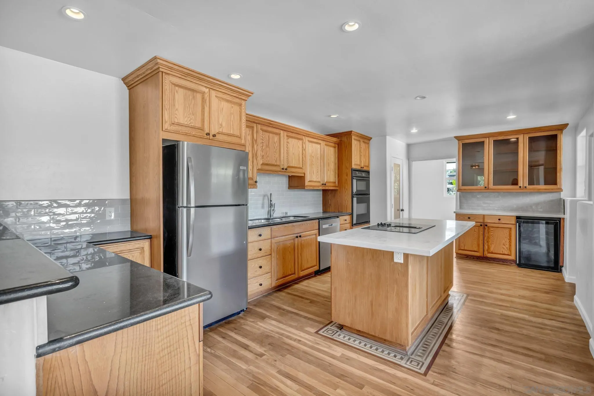 1230 Arnold Way Alpine, CA 91901 - Photo 11 of 60 a kitchen with stainless steel appliances granite countertop a sink stove and refrigerator