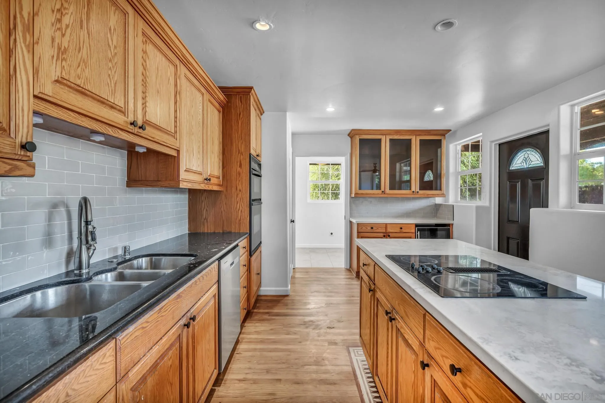 1230 Arnold Way Alpine, CA 91901 - Photo 12 of 60 a kitchen with stainless steel appliances granite countertop a sink stove and refrigerator