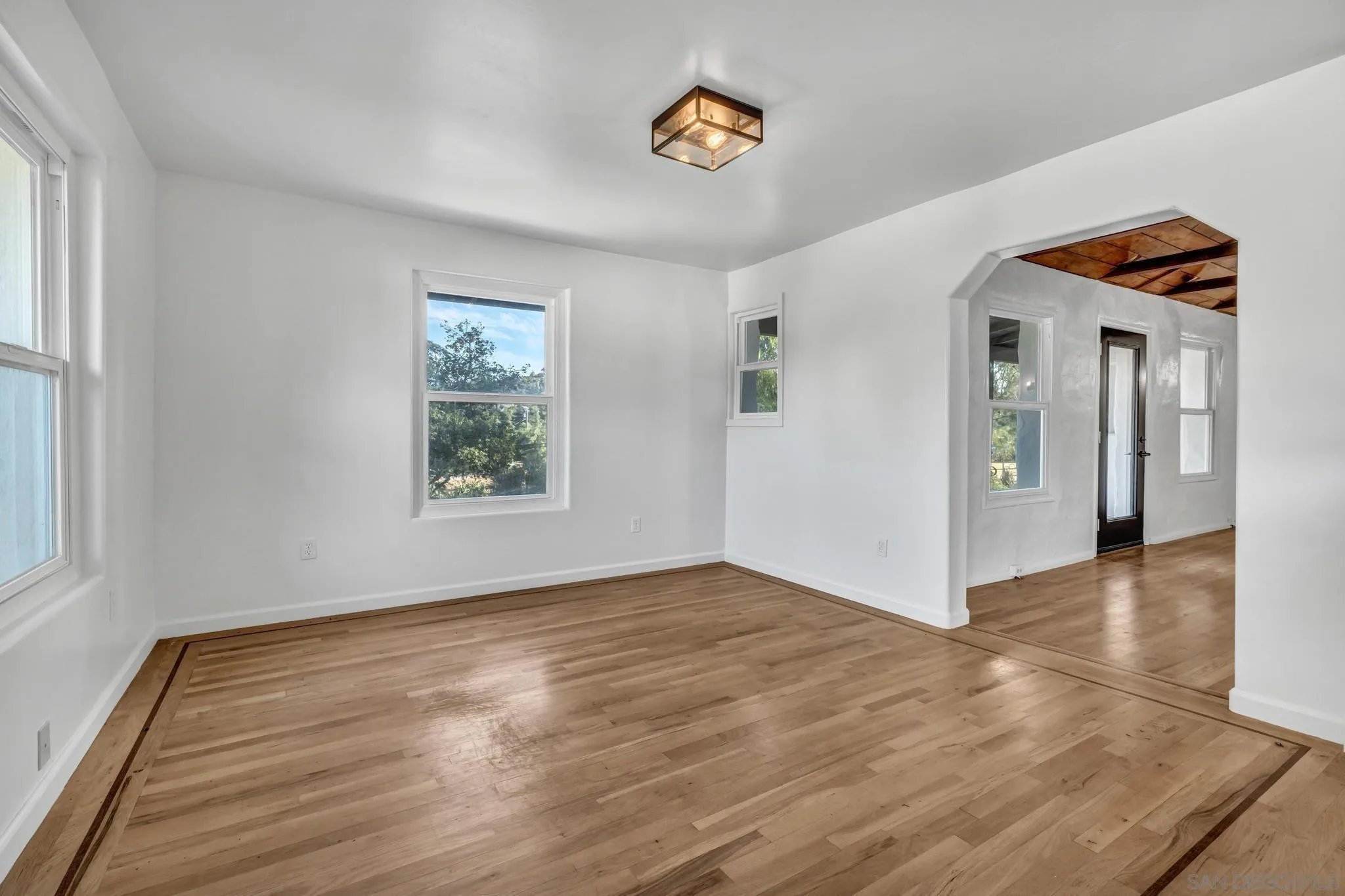 1230 Arnold Way Alpine, CA 91901 - Photo 17 of 60 a view of an empty room with window and wooden floor