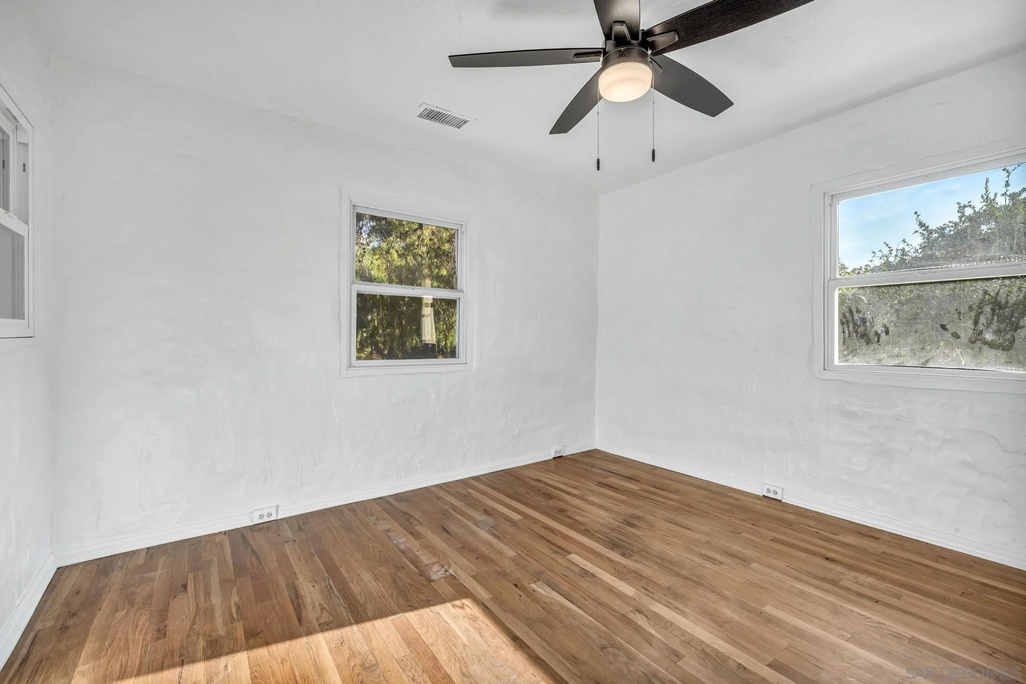 1230 Arnold Way Alpine, CA 91901 - Photo 20 of 60 a view of empty room with wooden floor