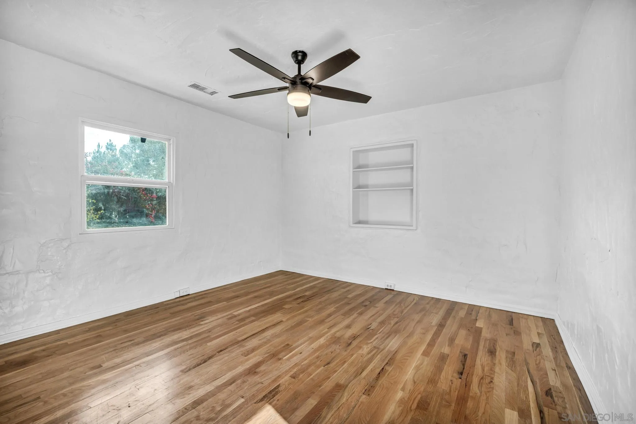 1230 Arnold Way Alpine, CA 91901 - Photo 22 of 60 wooden floor in an empty room with a window