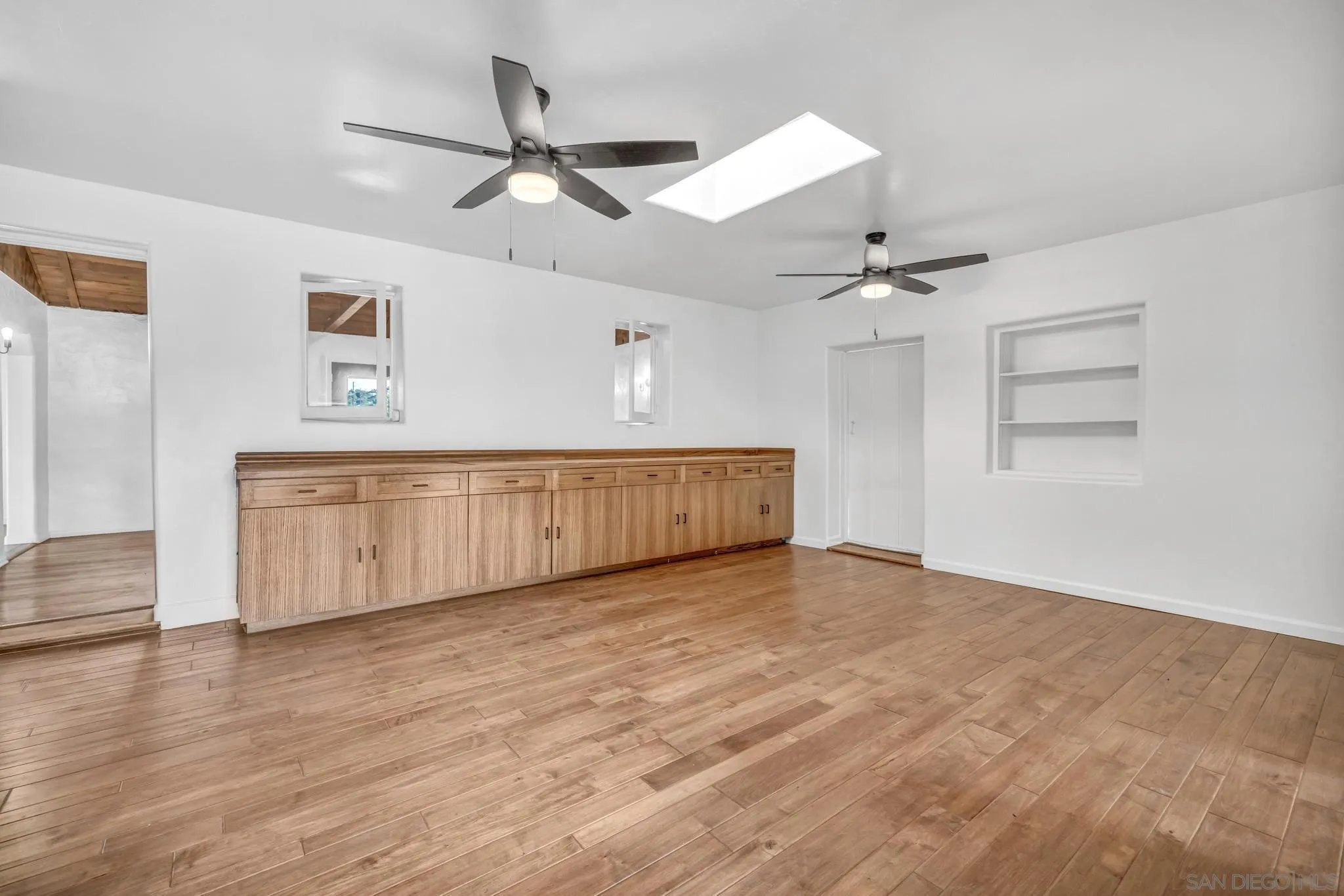 1230 Arnold Way Alpine, CA 91901 - Photo 28 of 60 a view of an empty room with window and wooden floor