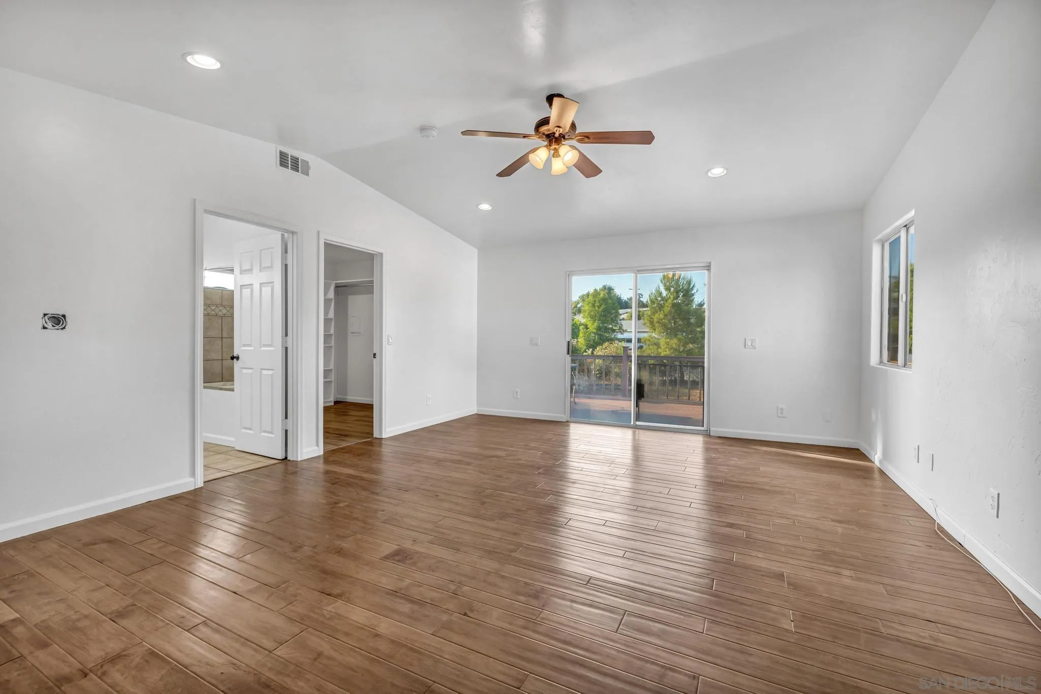 1230 Arnold Way Alpine, CA 91901 - Photo 29 of 60 a view of an empty room with window and wooden floor