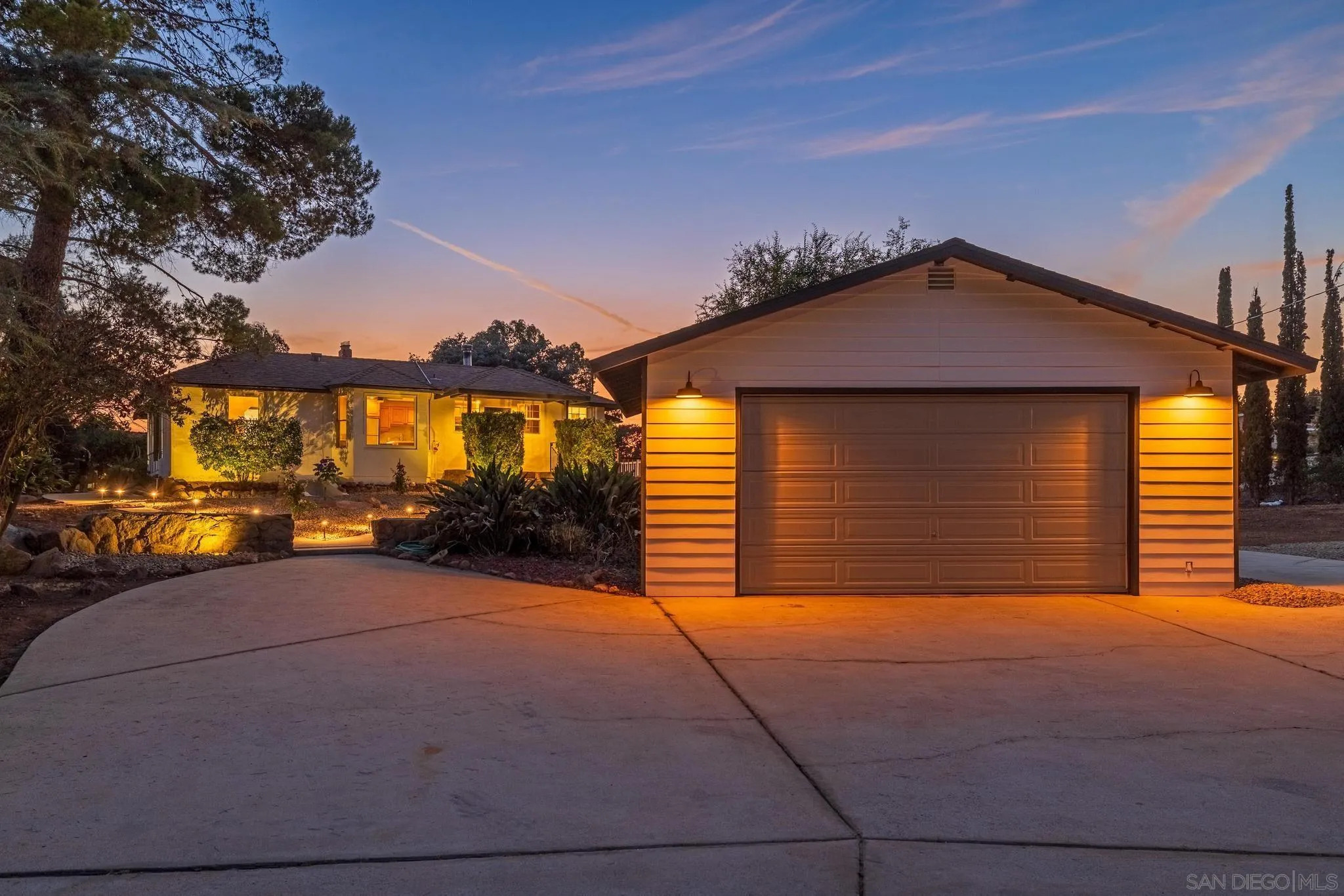 1230 Arnold Way Alpine, CA 91901 - Photo 45 of 60 a front view of a house with a yard and garage