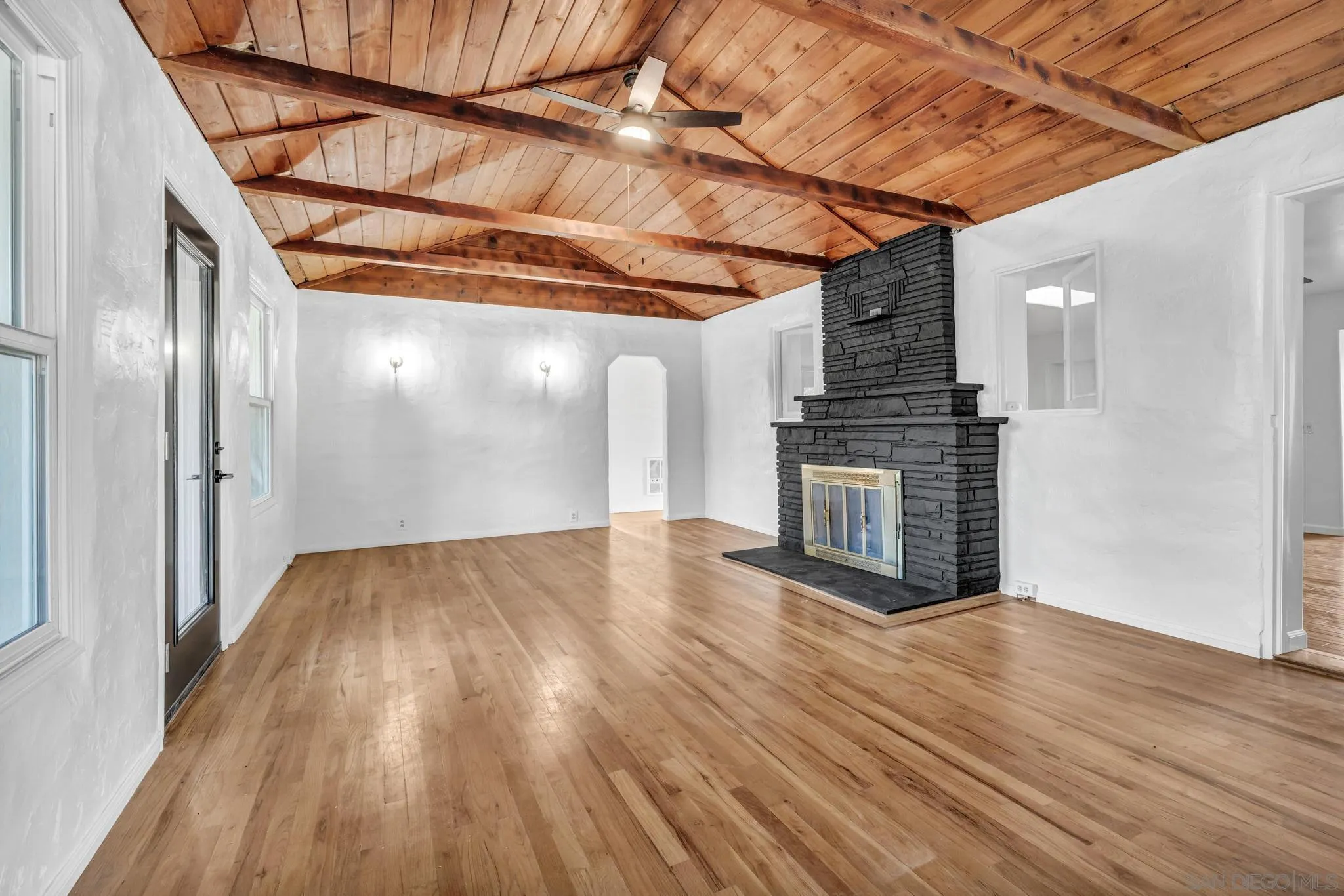 1230 Arnold Way Alpine, CA 91901 - Photo 5 of 60 a view of an empty room with wooden floor and a window