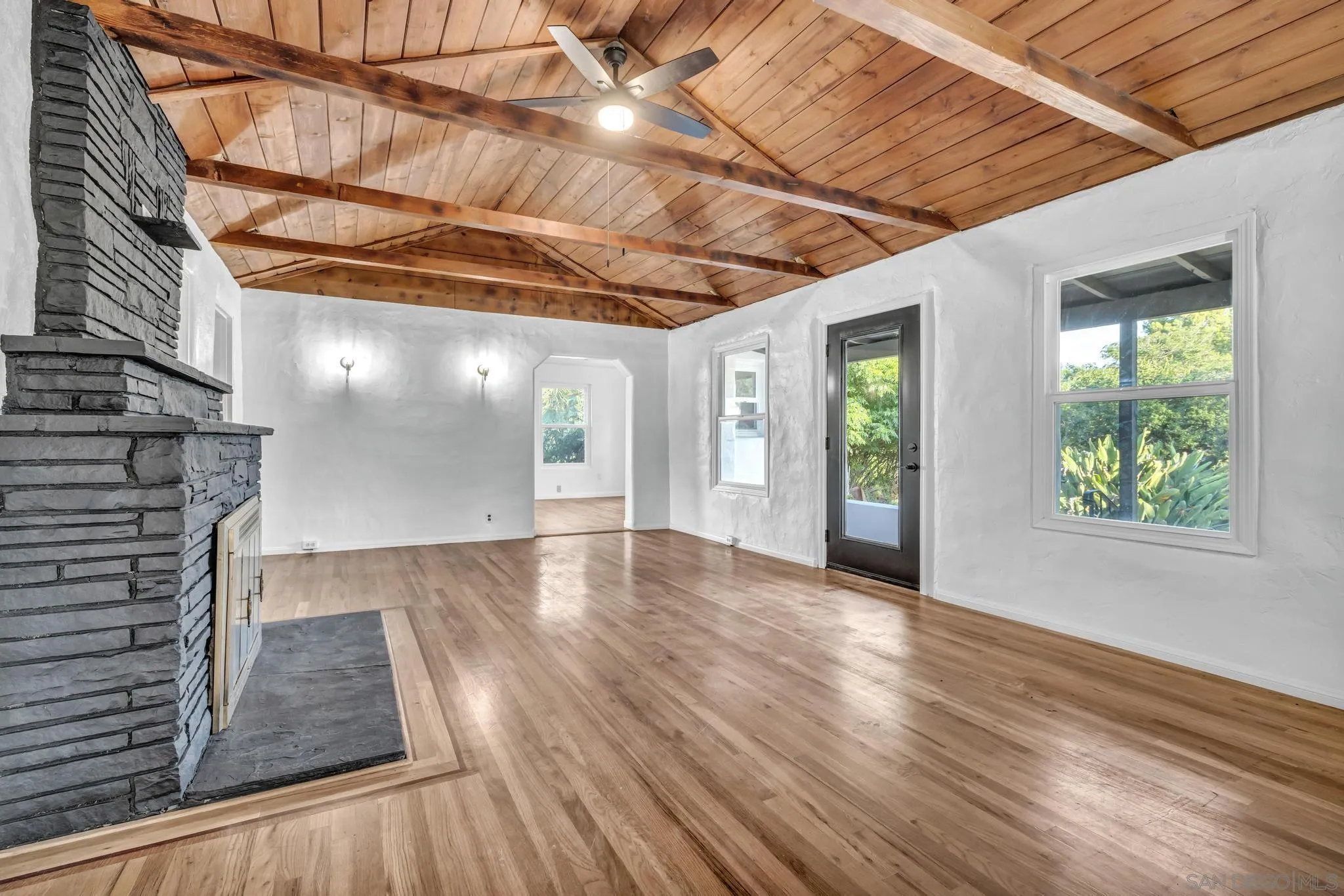 1230 Arnold Way Alpine, CA 91901 - Photo 8 of 60 a view of an empty room with wooden floor and a window