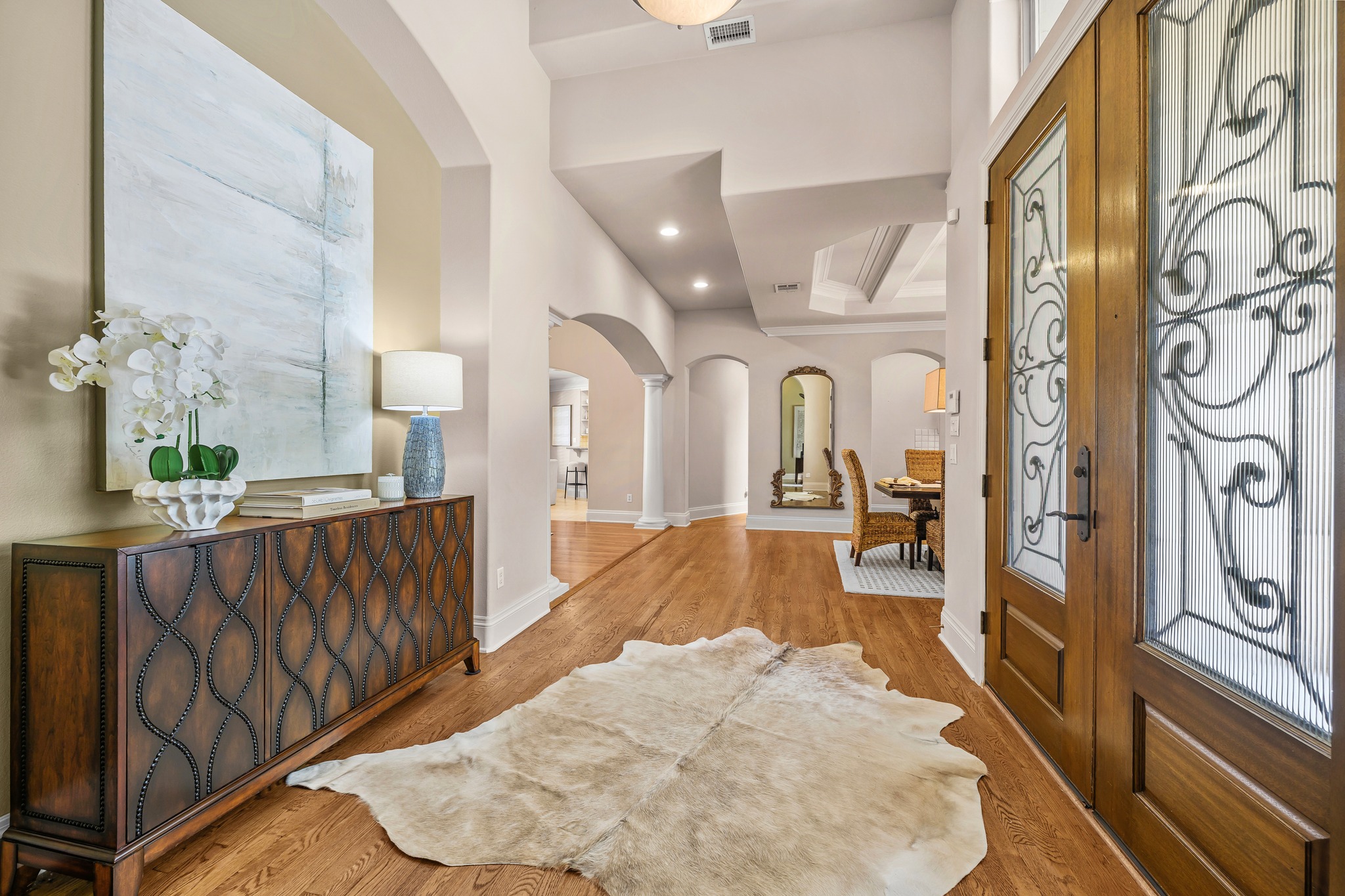 5200 Rico Cove Austin, TX 78731 - Photo 2 of 40 Hardwood floors and soaring arched passageways create a warm welcome in this gracious entryway.