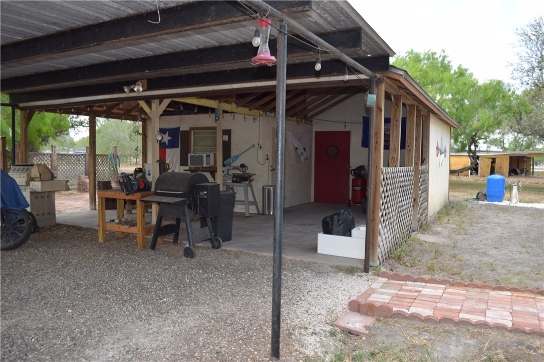 24772 County Road 360 Mathis, TX 78368 - Photo 25 of 30 a view of a porch with furniture and a yard