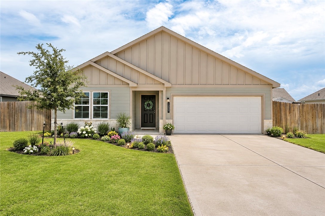 137 Windmill Road Somerville, TX 77879 - Photo 2 of 17 a front view of house with a garden and patio