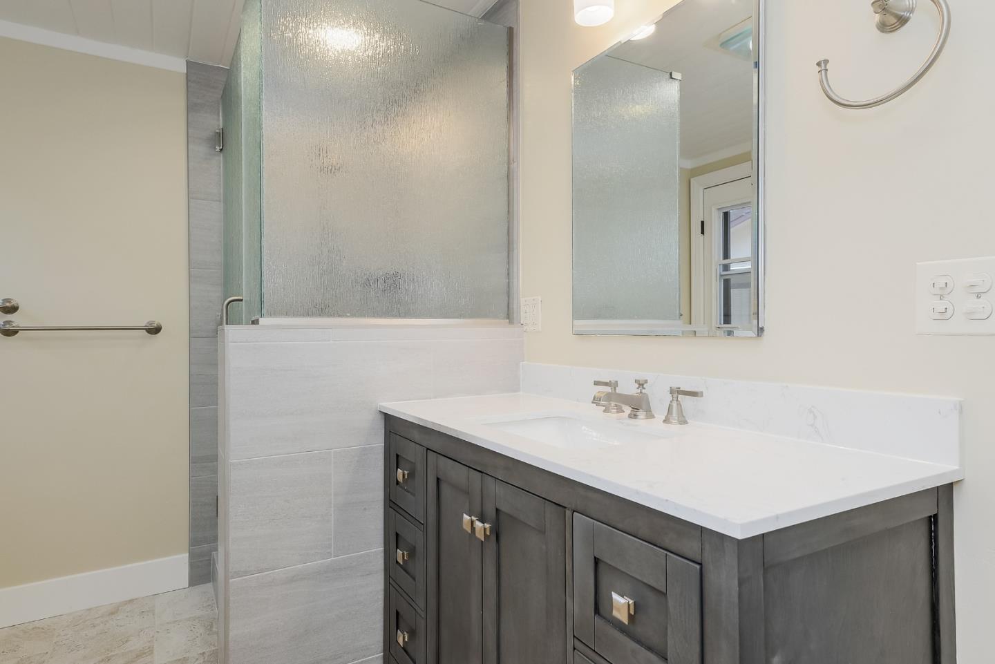 1249 Lime Drive Sunnyvale, CA 94087 - Photo 12 of 24 a bathroom with a sink vanity and a mirror