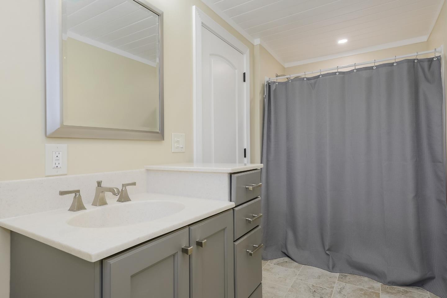 1249 Lime Drive Sunnyvale, CA 94087 - Photo 17 of 24 a bathroom with a sink and a mirror