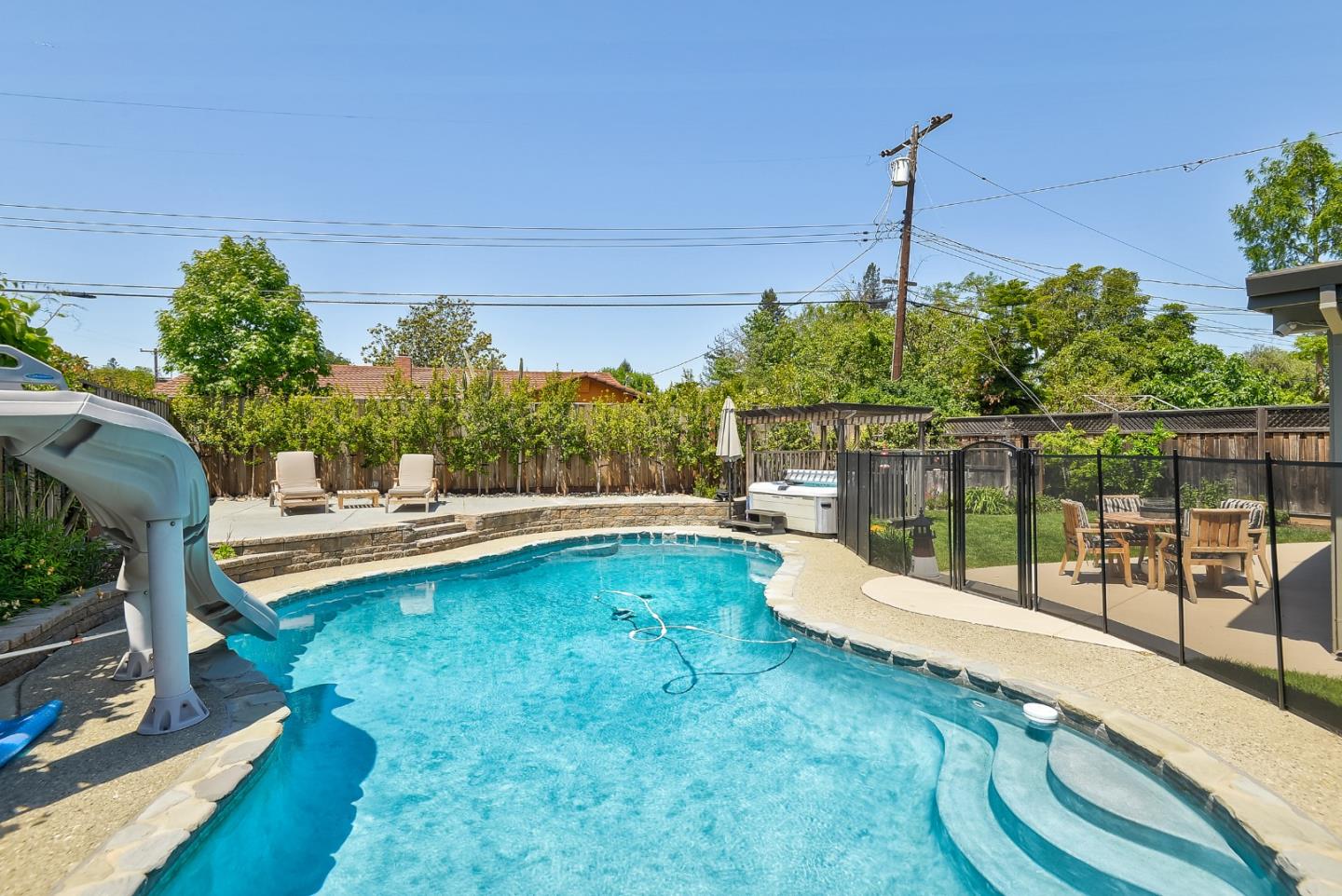 1249 Lime Drive Sunnyvale, CA 94087 - Photo 22 of 24 a view of a swimming pool with a patio