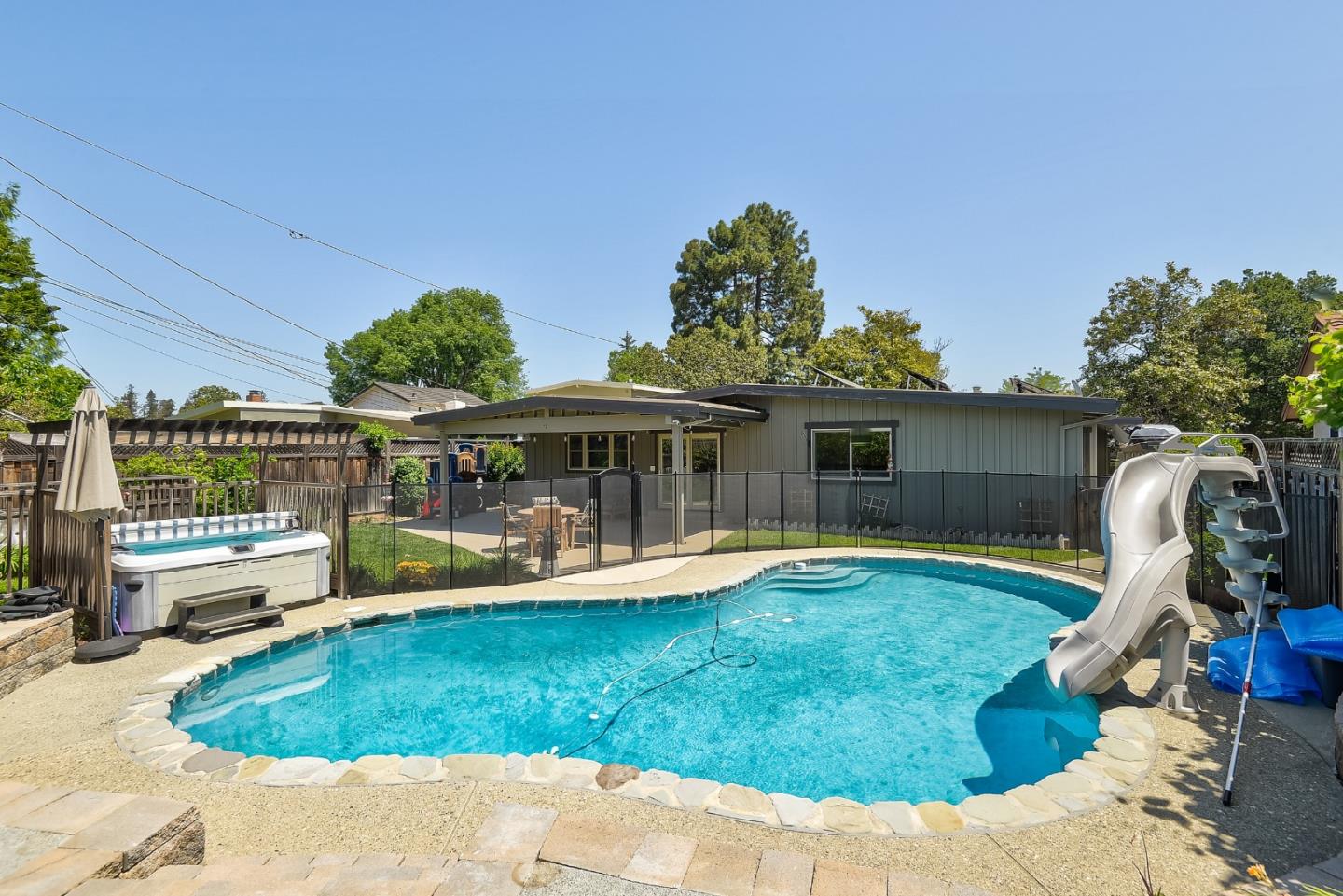 1249 Lime Drive Sunnyvale, CA 94087 - Photo 23 of 24 a view of a house with backyard sitting area and tub