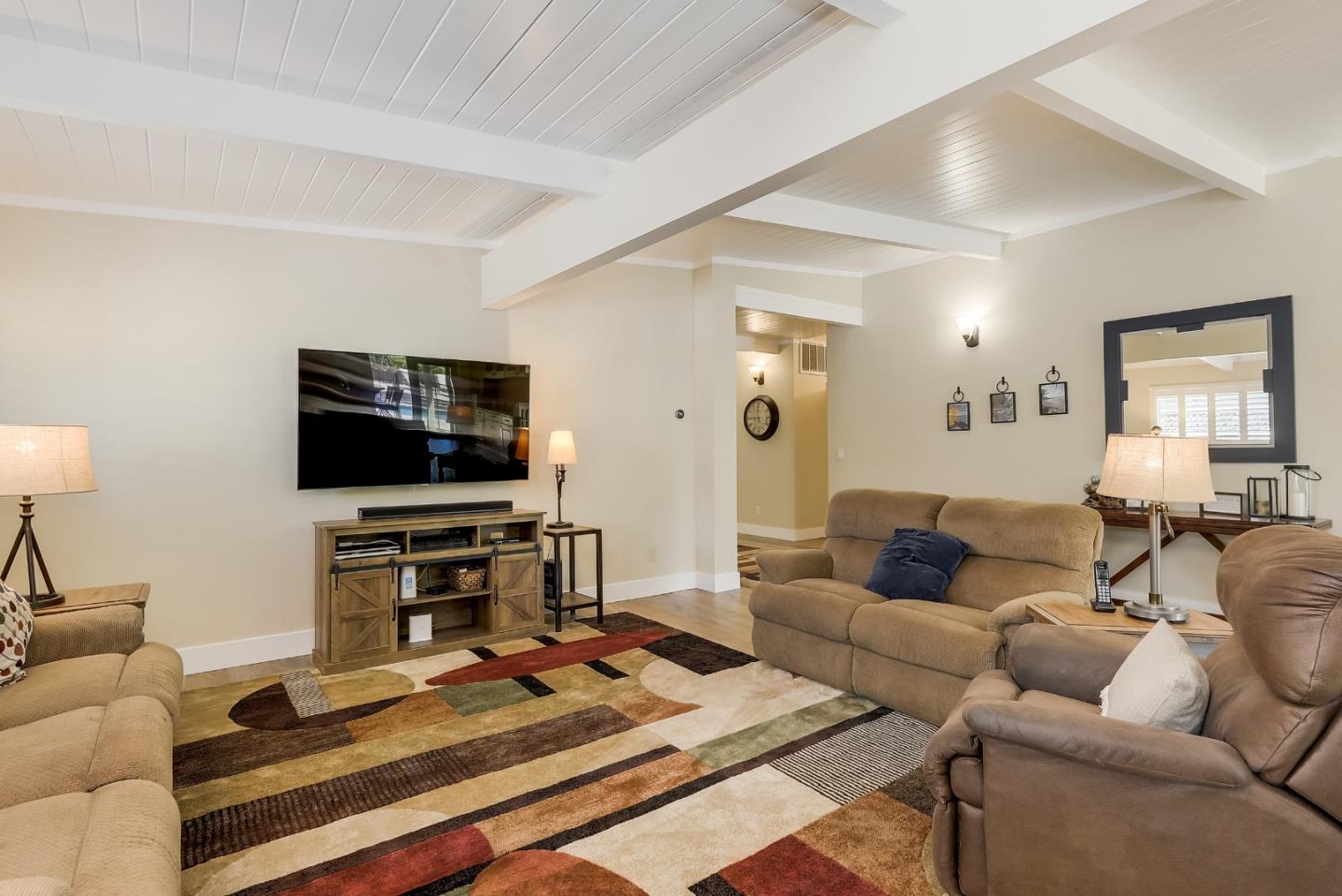 1249 Lime Drive Sunnyvale, CA 94087 - Photo 4 of 24 a living room with furniture and a flat screen tv