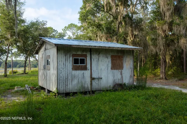 a backyard of a house with lots of green space