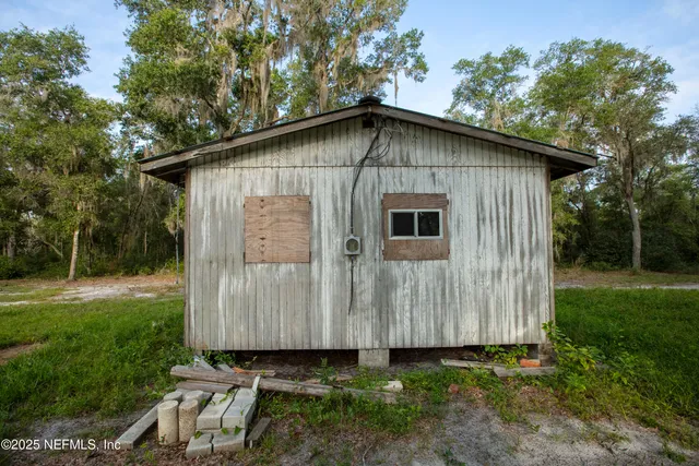 a backyard of a house with lots of green space