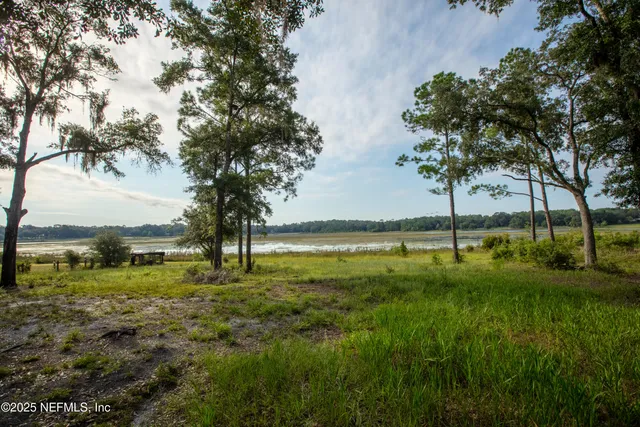 a swimming pool with an outdoor space and seating