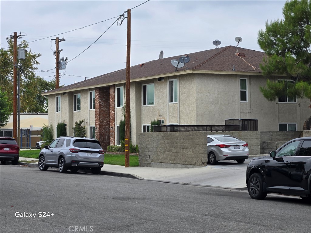 24522 Chestnut Street Newhall, CA 91321 - Photo 3 of 7 a view of a car parked in front of a house