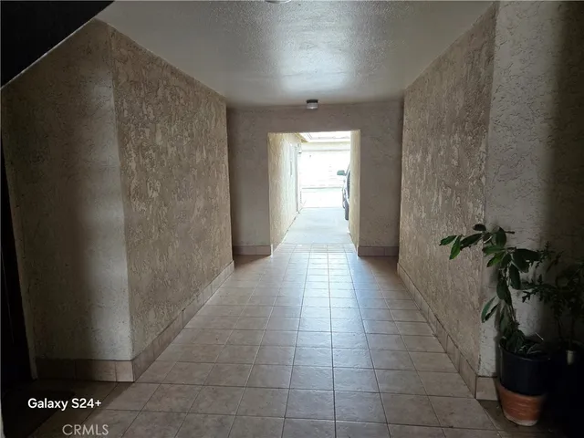 a hallway with a window in a house