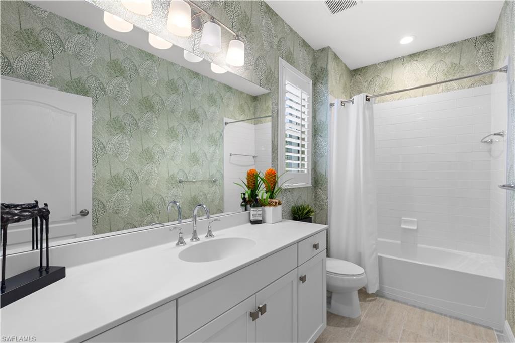 2311 Sawyers Hill Road, Unit 805 Naples, FL 34120 - Photo 20 of 27 a bathroom with a sink a toilet and shower