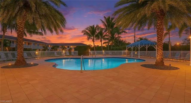 a view of a swimming pool with a patio