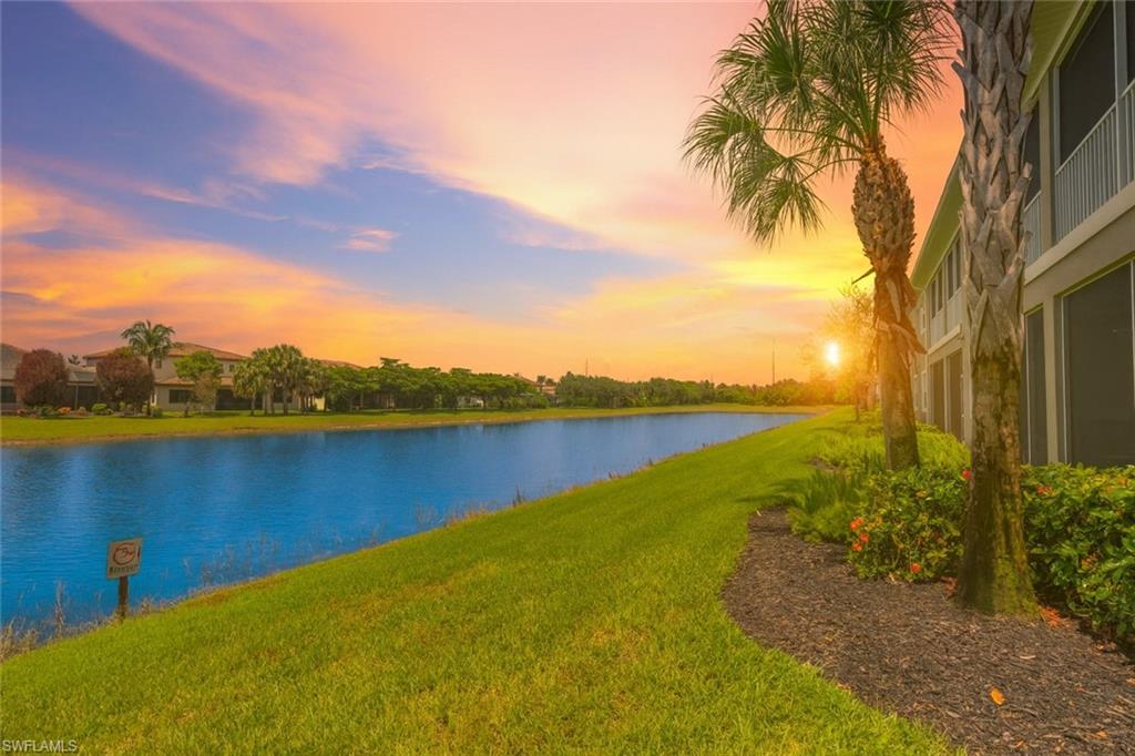 2311 Sawyers Hill Road, Unit 805 Naples, FL 34120 - Photo 7 of 27 a view of a lake with a yard