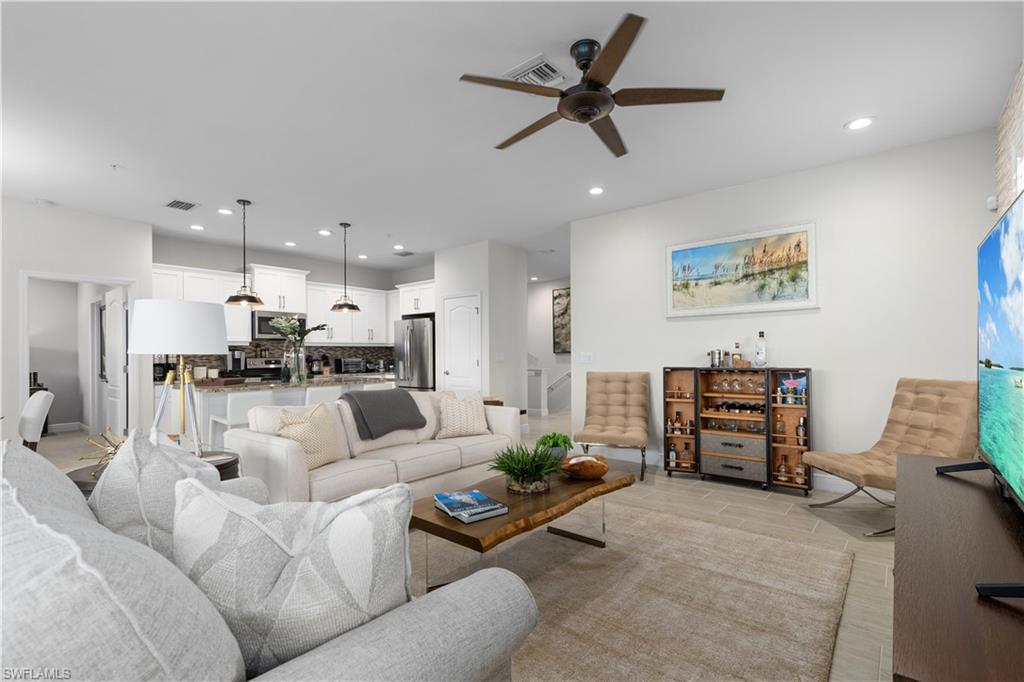 2311 Sawyers Hill Road, Unit 805 Naples, FL 34120 - Photo 10 of 27 a living room with furniture and kitchen view