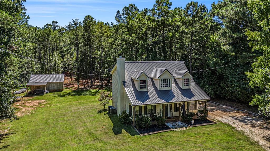aerial view of a house with a yard