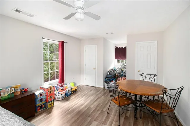 a view of a dining room with furniture and chandelier