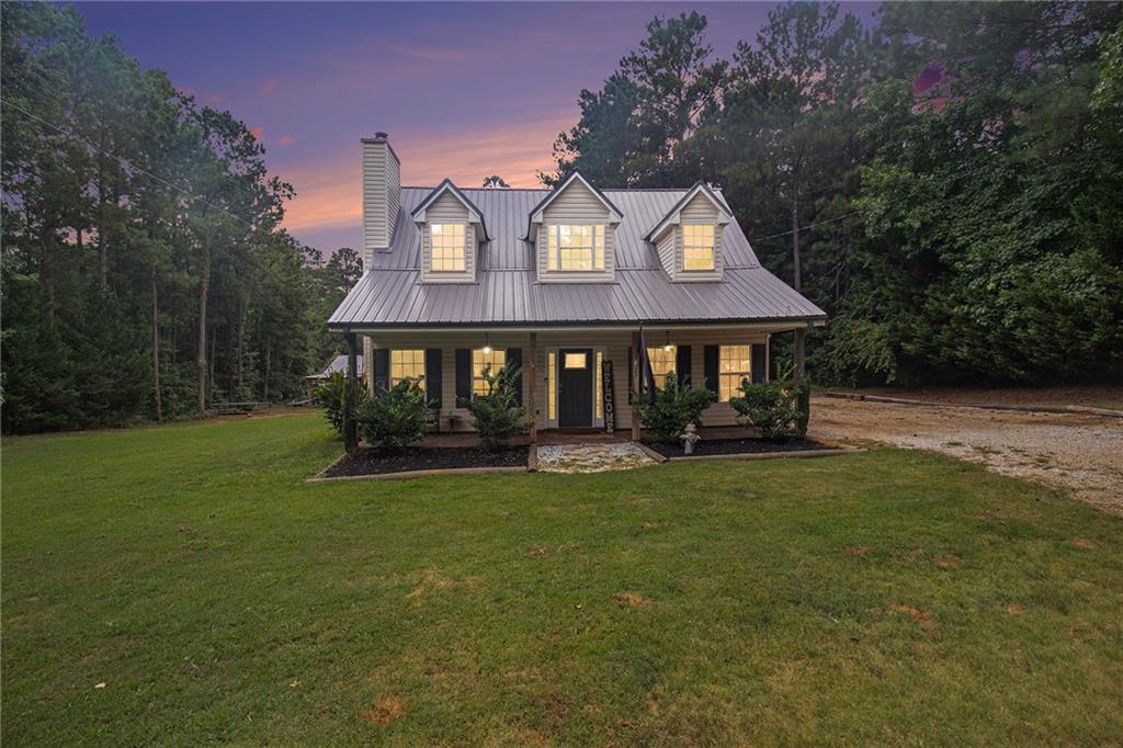 23 Erskine Road Monticello, GA 31064 - Photo 2 of 38 a front view of a house with a garden