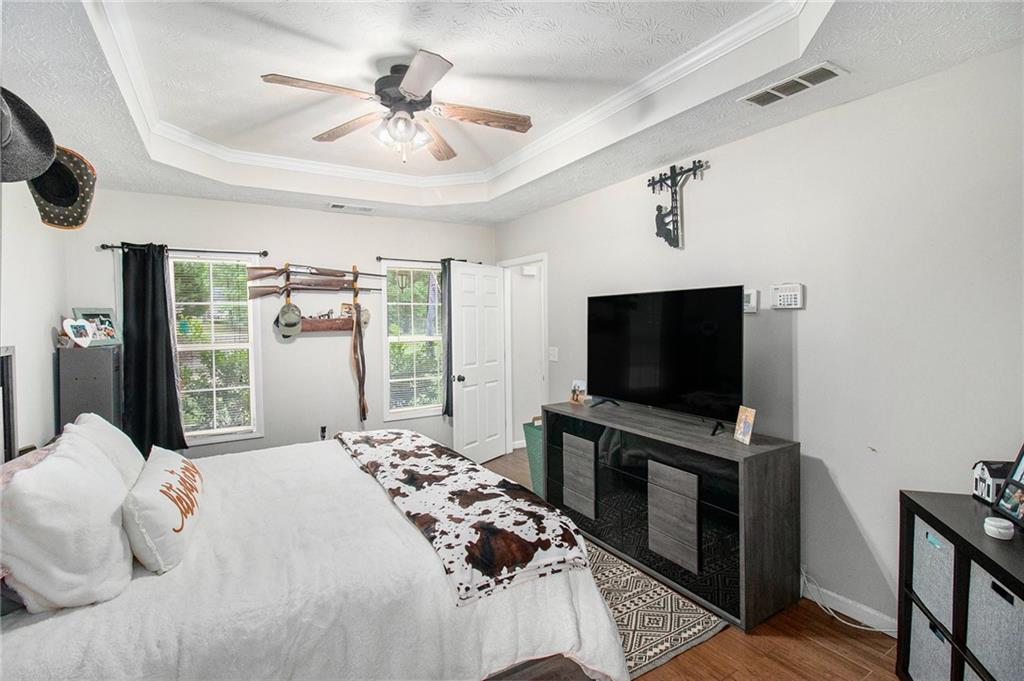 23 Erskine Road Monticello, GA 31064 - Photo 25 of 38 a bedroom with a bed and a flat screen tv