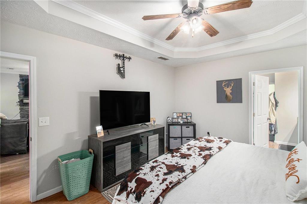 23 Erskine Road Monticello, GA 31064 - Photo 26 of 38 a bedroom with furniture and a flat screen tv