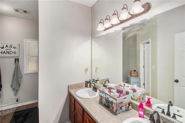 a en suite bathroom with a sink and a shower