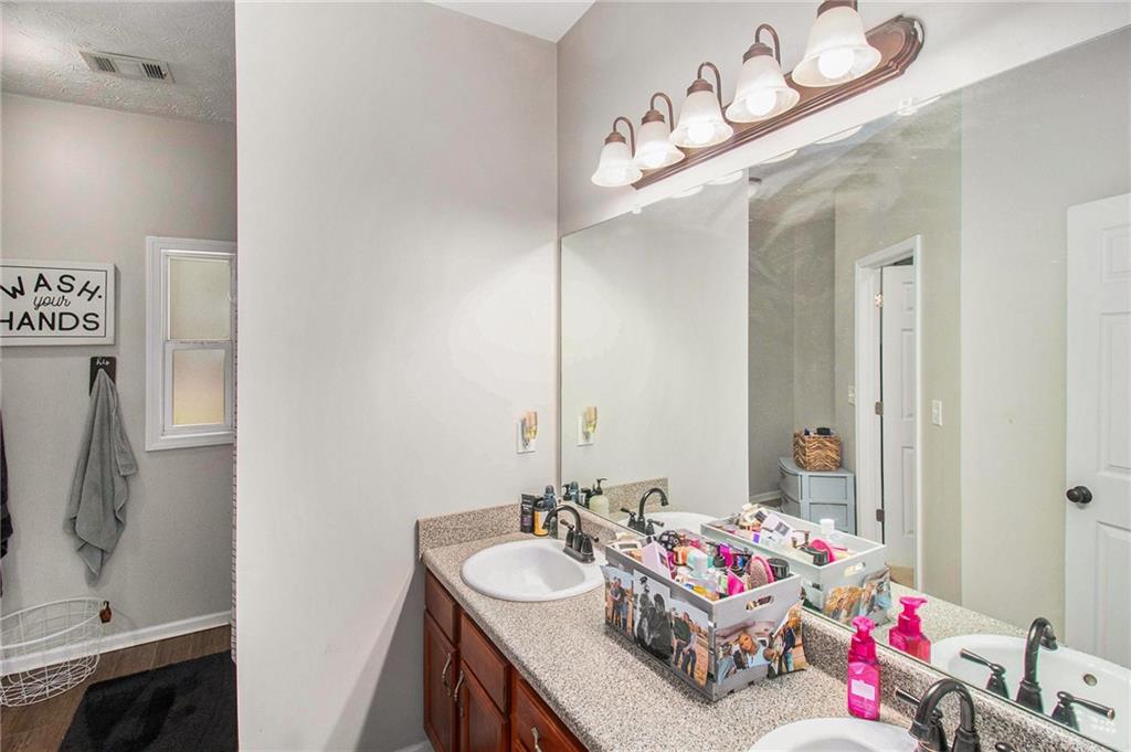 23 Erskine Road Monticello, GA 31064 - Photo 27 of 38 a bathroom with a sink and a mirror