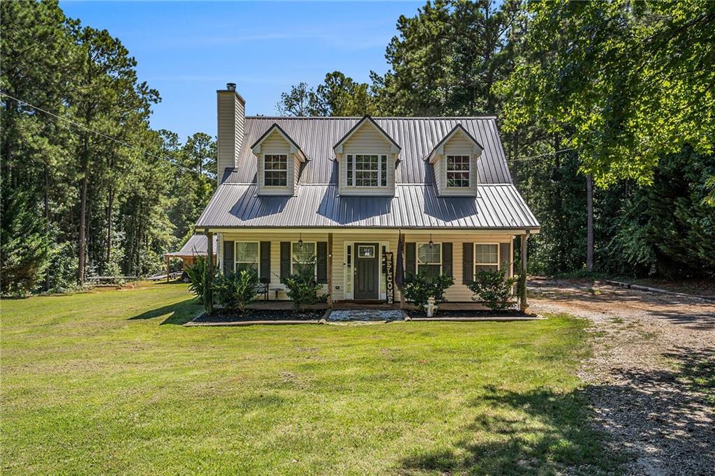 23 Erskine Road Monticello, GA 31064 - Photo 34 of 38 a front view of a house with a yard balcony