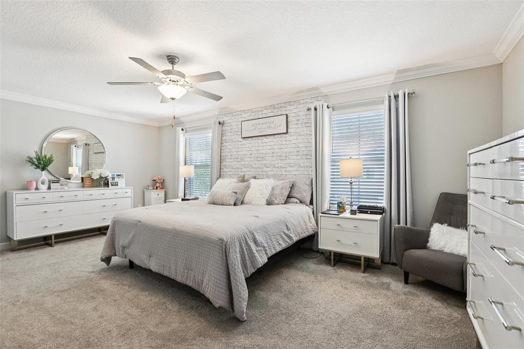 1306 White Fox Run Lutz, FL 33549 - Photo 19 of 35 a bed room with a bed and a window