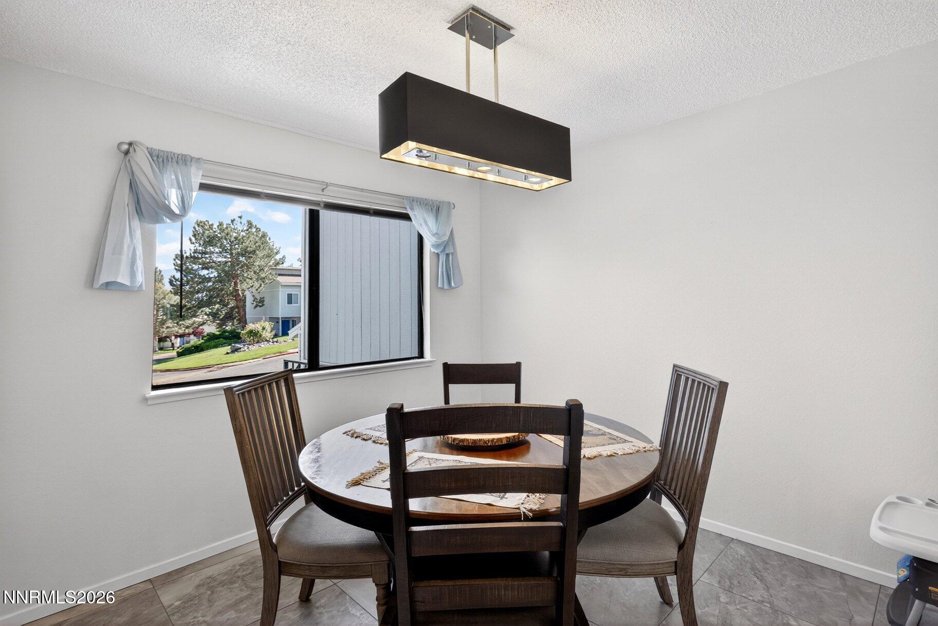 3415 Balboa Drive Reno, NV 89503 - Photo 49 of 61 a view of a dining room with furniture and a window