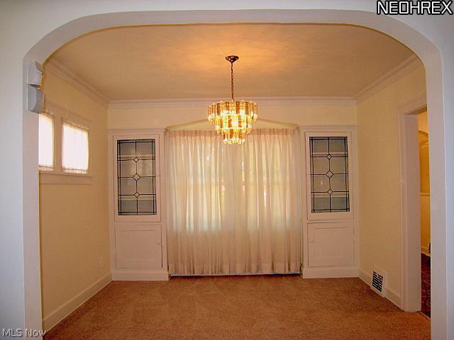 1051 Roanoke Road Cleveland, OH 44121 - Photo 6 of 25 Formal Dining Rm for Entertaining and Holidays. Built-In China Cabinets and Newer Light Fixture. New Carpet and Freshly Painted.